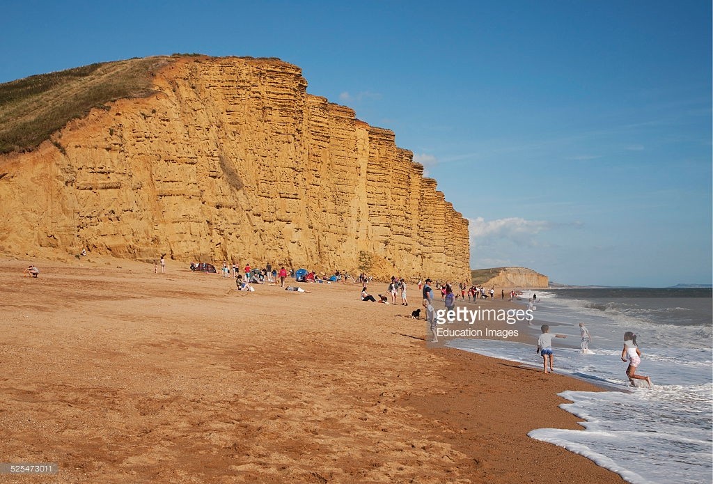 sandstone-cliffs-and-beach-west-bay-bridport-dorset-england-picture-id525473011.jpg